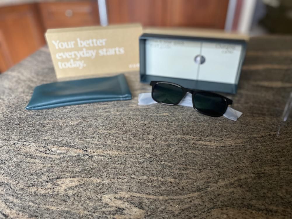 Photo of Vue Lite 2 Smart Audio Sunglasses unboxed on a countertop.