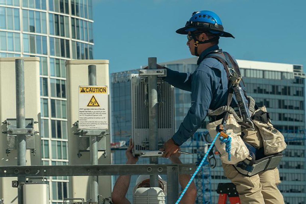 AT&T installer working on installing 5 Gig service on a cell tower