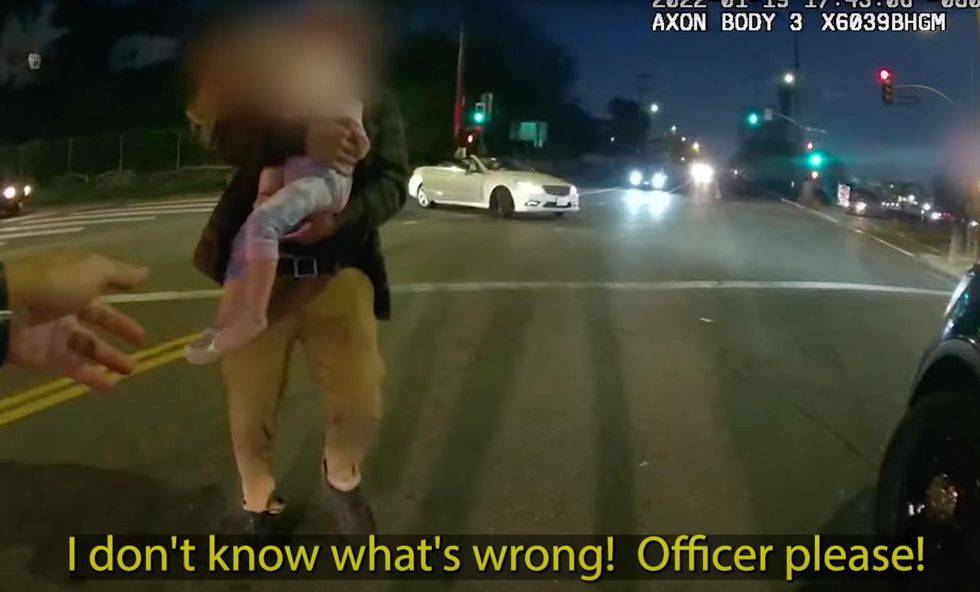 Dramatic video shows father on his knees begging as hero cop saves his choking baby’s life: ‘Officer, please!’