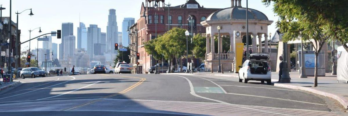 Photo of a city from a street view.