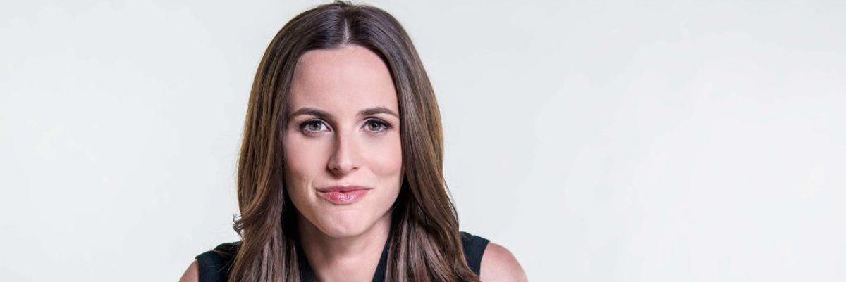 pictured alicia menendez in a white background smiling at the camera
