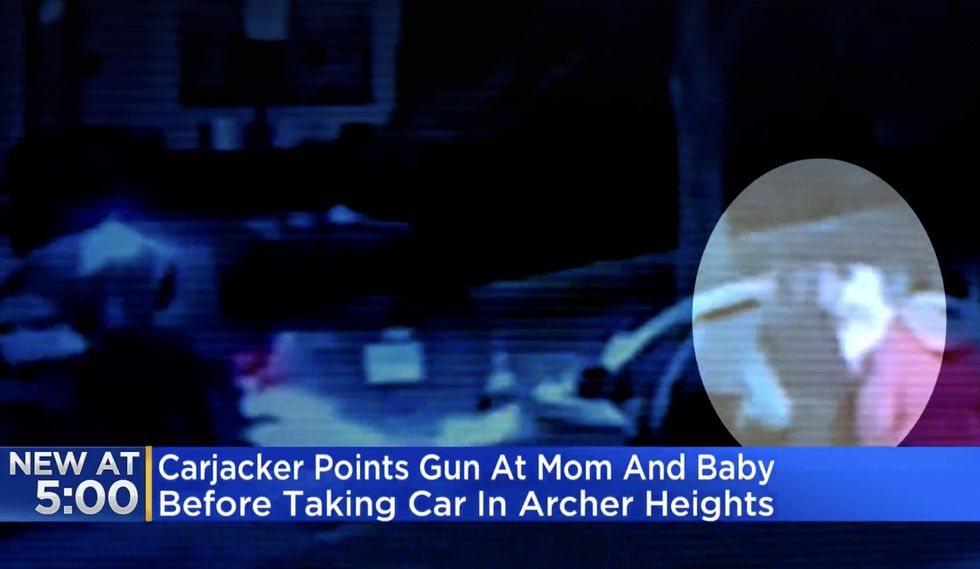 VIDEO: Carjacker points gun at 1-year-old girl, her mother, and third victim in Chicago. After thugs take their vehicle, victims run to safety.