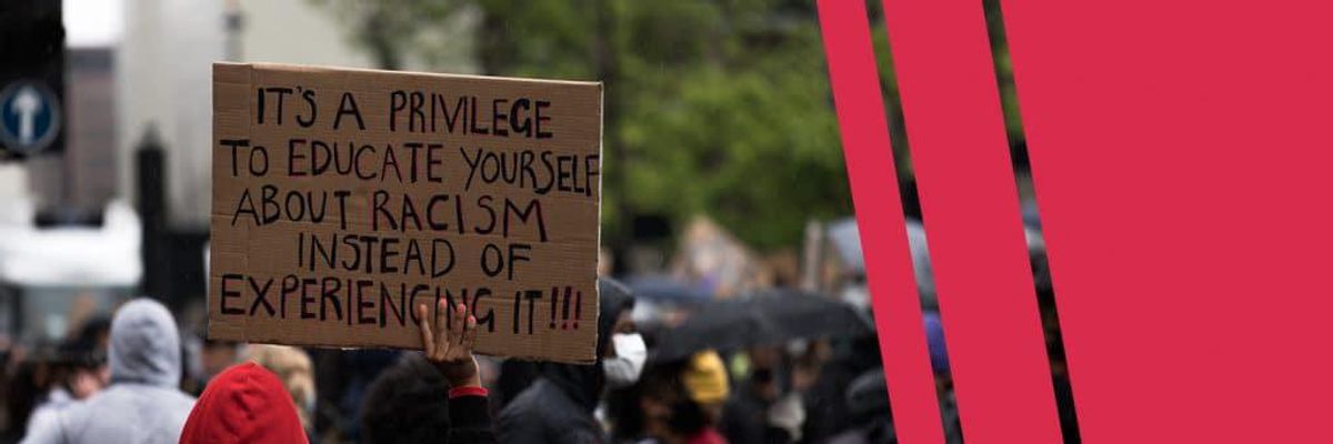 Sign that says "It's a privilege to educate yourself about racism instead of experiencing it".