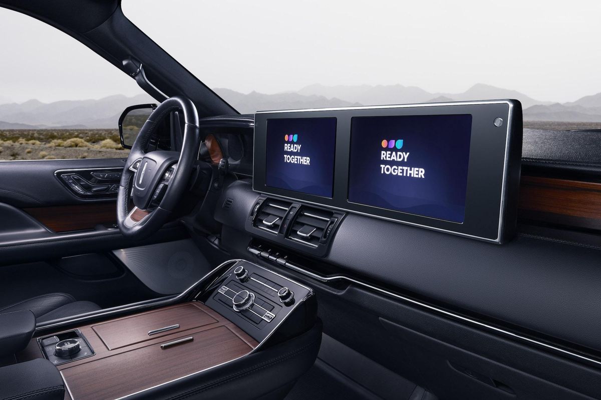 Harman Ready Together technology on displays on a car's dashboard screens.