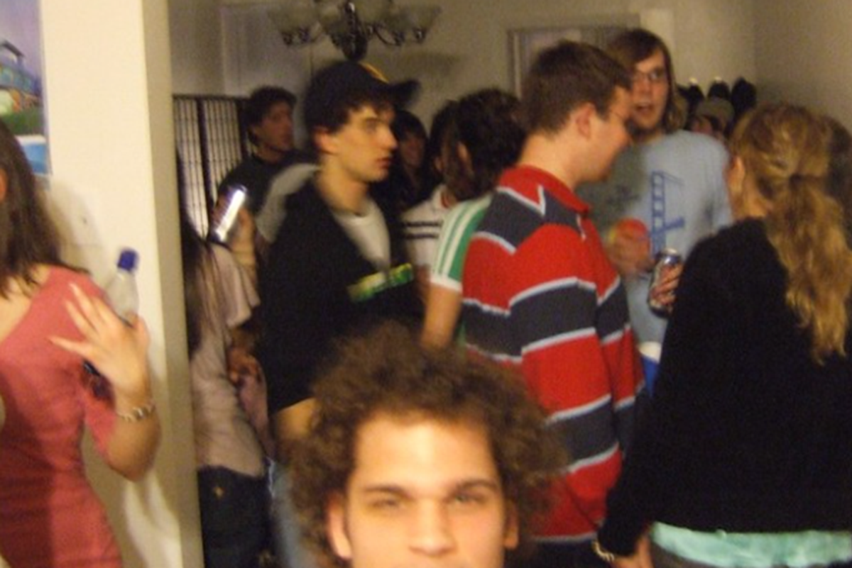 a blurred photo of people at a house party
