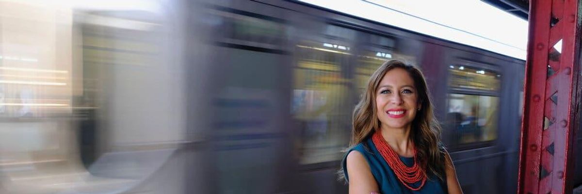 Latina woman, Jessica González-Rojas, standing in front of the subway