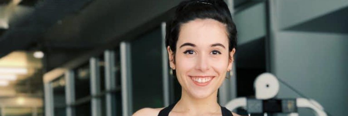Woman smiling at the gym.