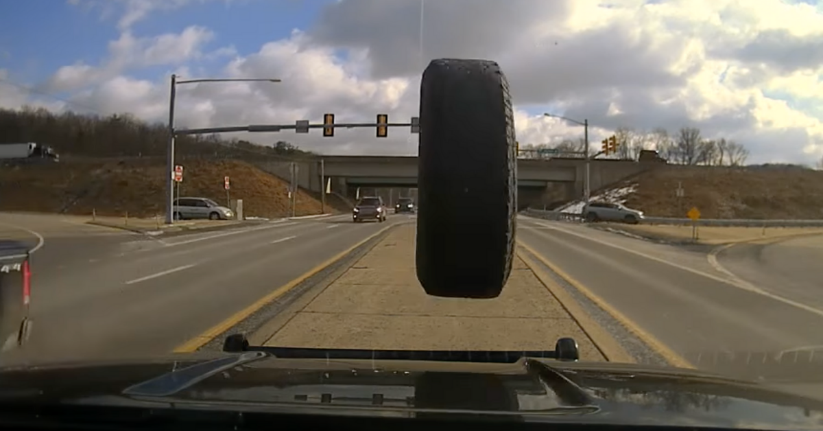 Police Cruiser's Dashcam Captures Harrowing Moment A Runaway Tire Crashes Into Windshield