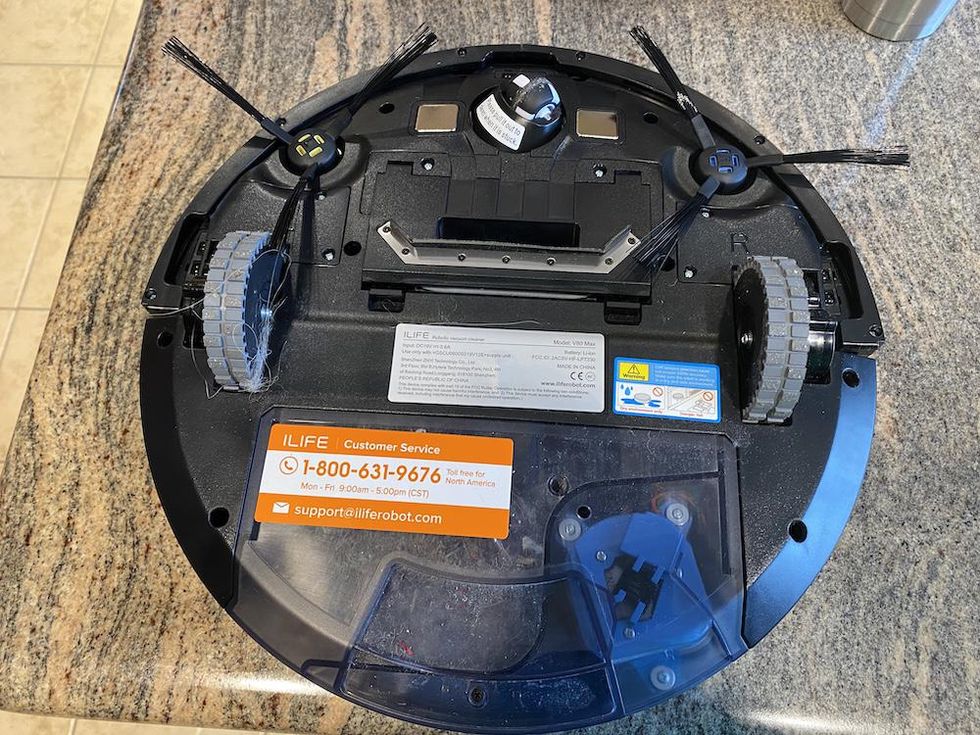 Photo of the bottom of ILIFE V80 Max robot vacuum with long side brushes