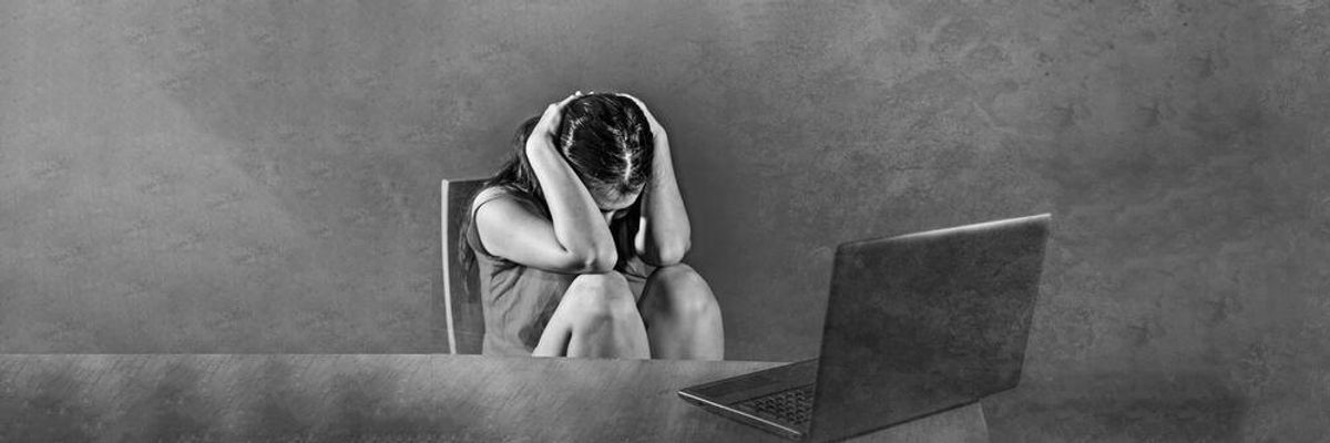 Girl sitting in front of a computer screen