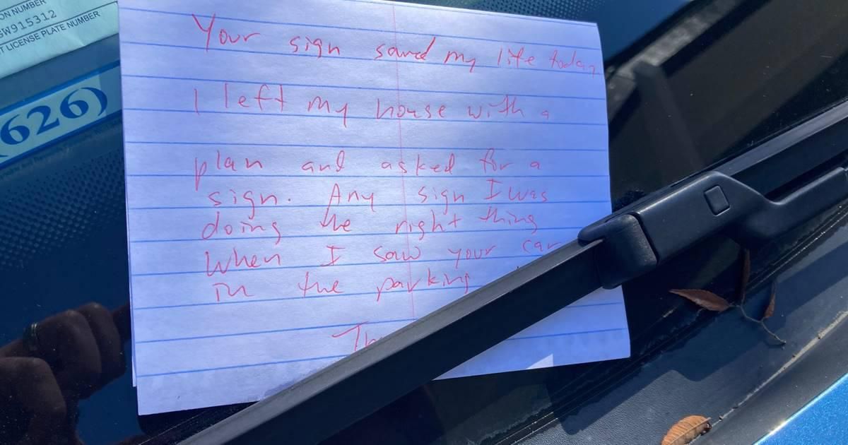 note tucked under a windshield wiper