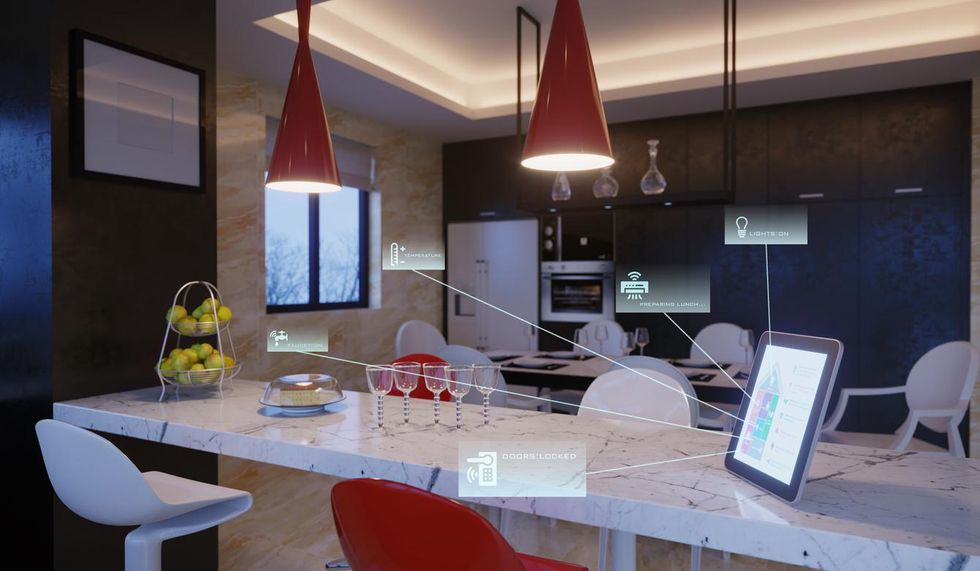 Photo of a smart kitchen with tablet acting as a hub for all devices.