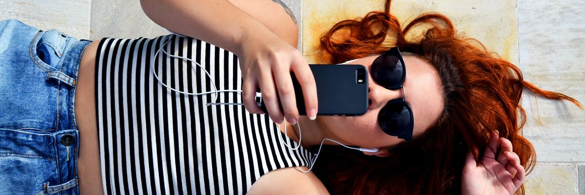 woman looking at her cellphone