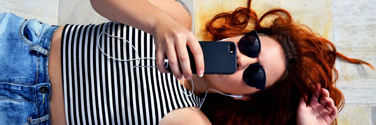 woman looking at her cellphone 