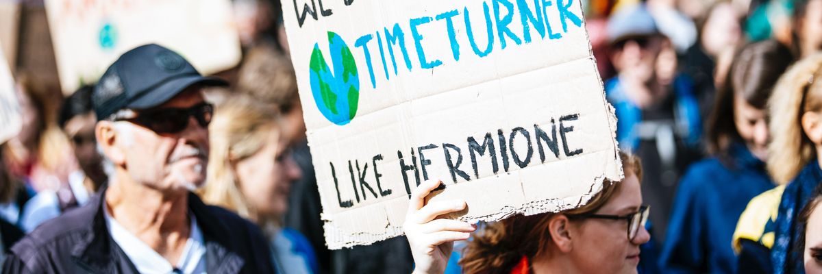 people holding signage during daytime