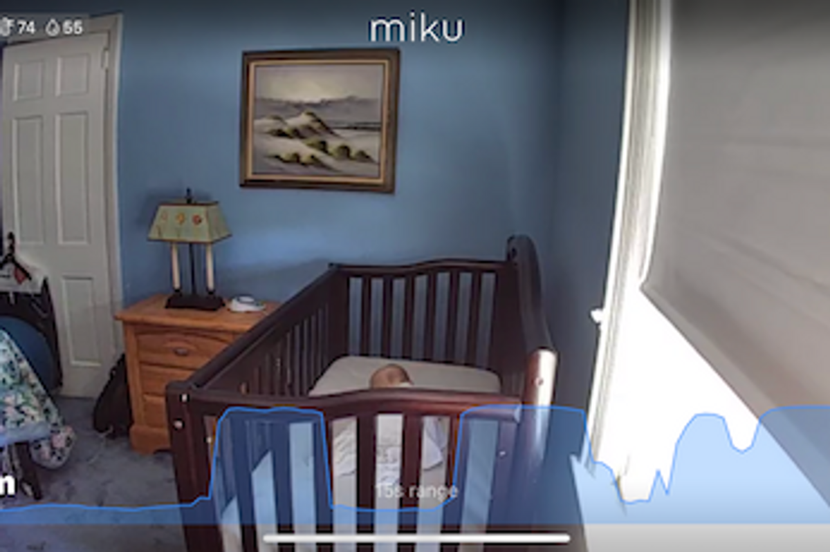 Photo of Miku app showing a baby sleeping with breathing being monitored on the app