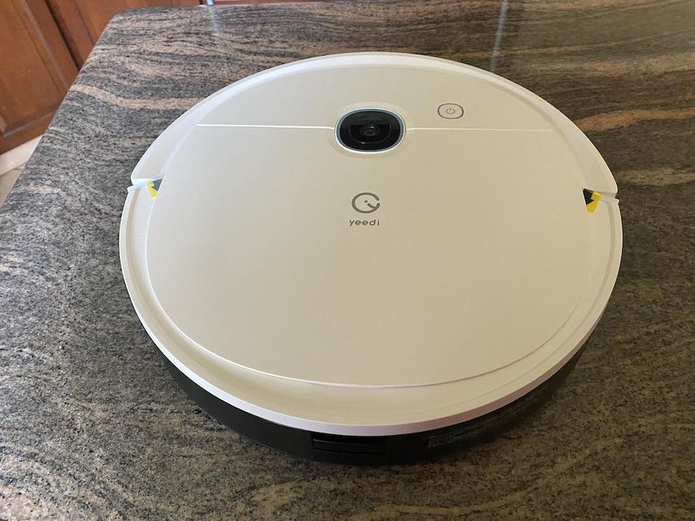 a photo of yeedi vac 2 pro robot vacuum and mop combo on a countertop