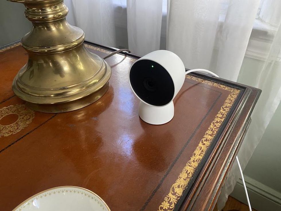 A photo of Google Nest Cam 2nd Gen on an end table.