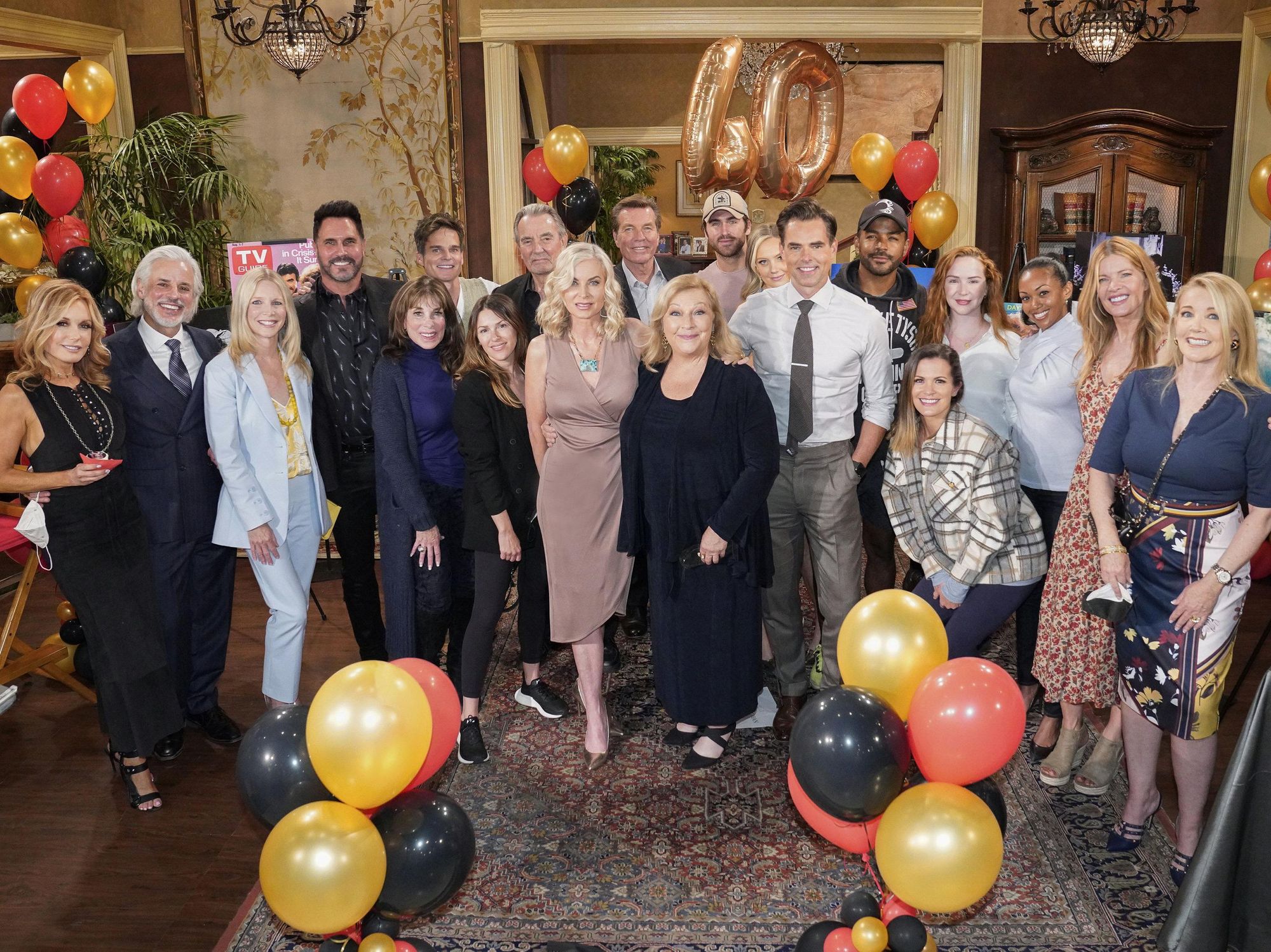 Eileen Davidson and Beth Maitland surrounded by their cast mates and balloons