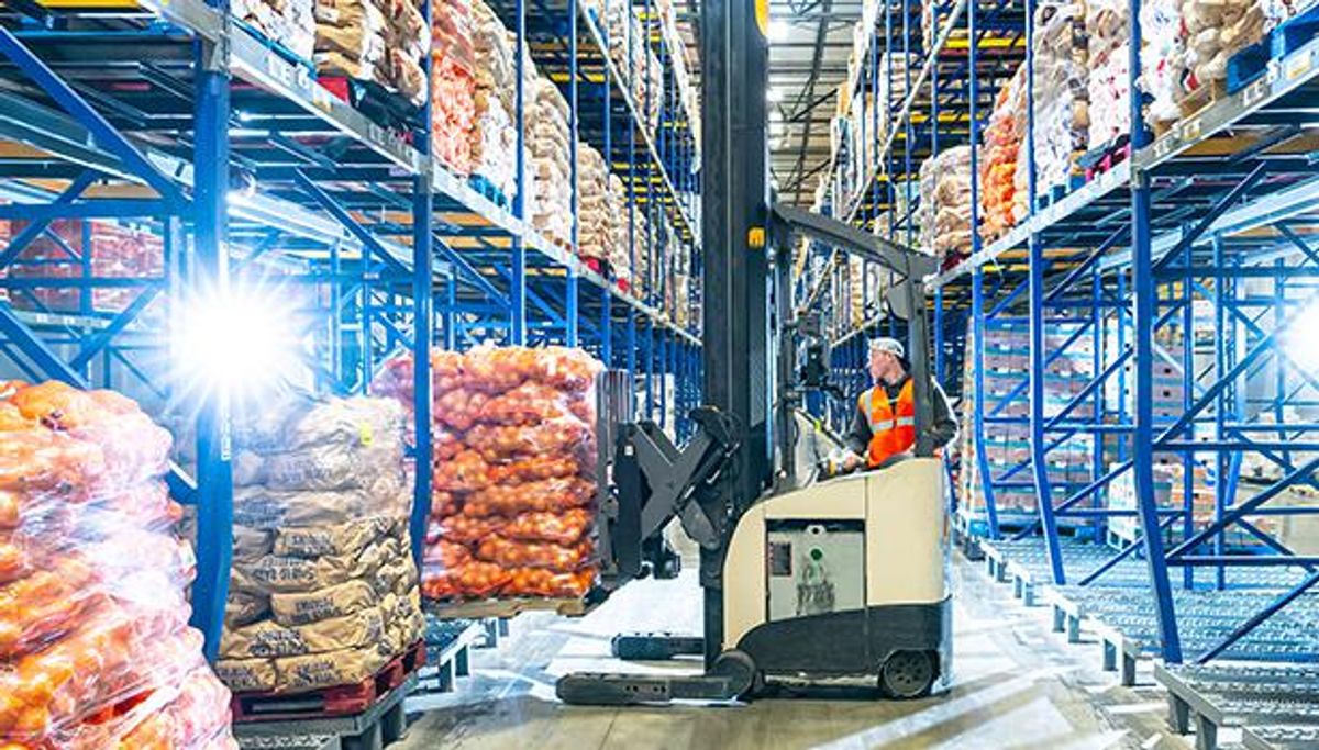 associate on a forklift in a warehouse