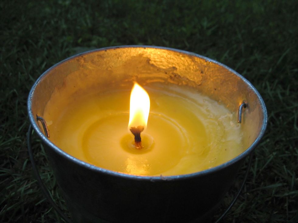 Aerial photo of a lit citronella candle
