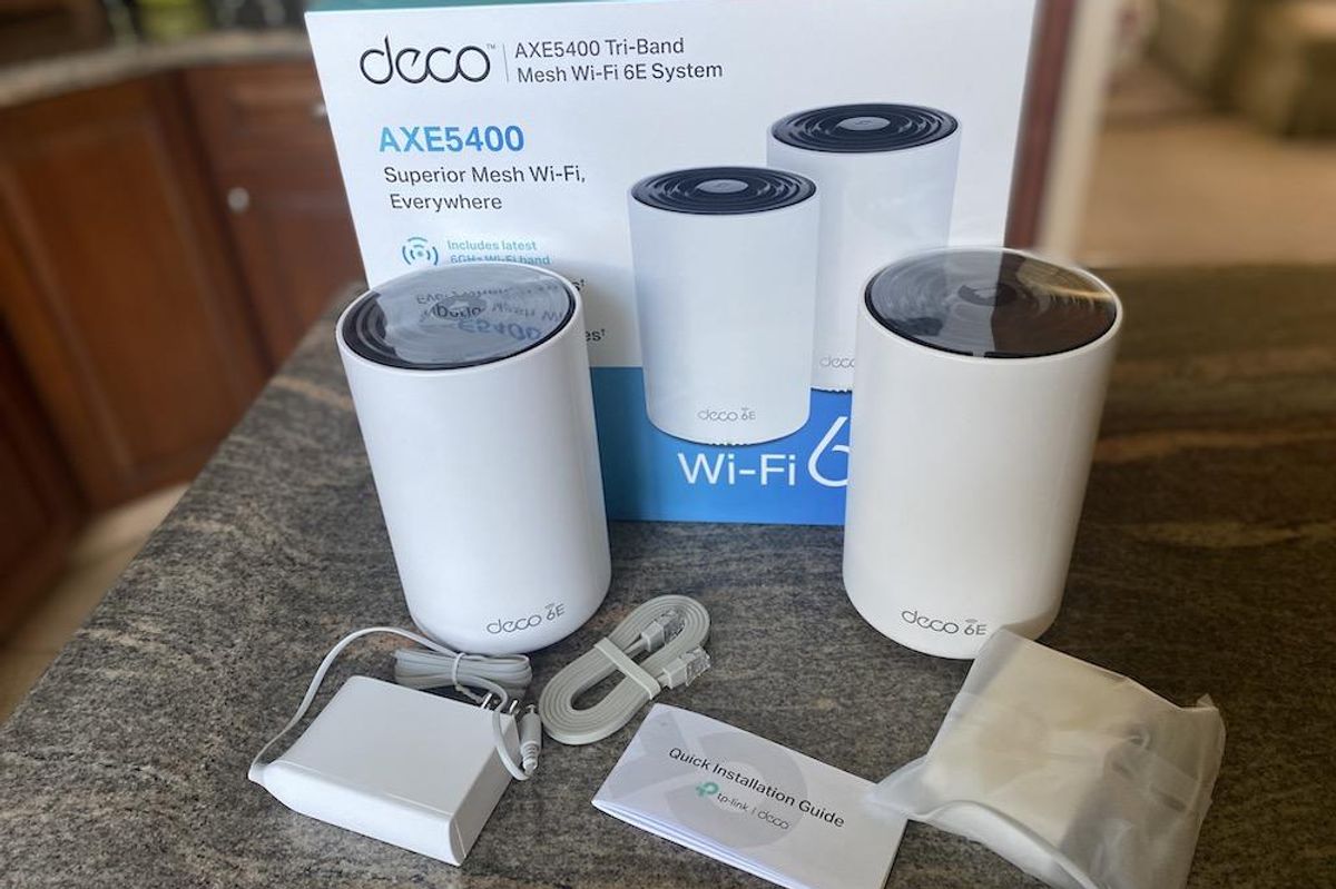 a photo of Deco axe5400 Tri-Band Mesh Wi-Fi 6e system unboxed.