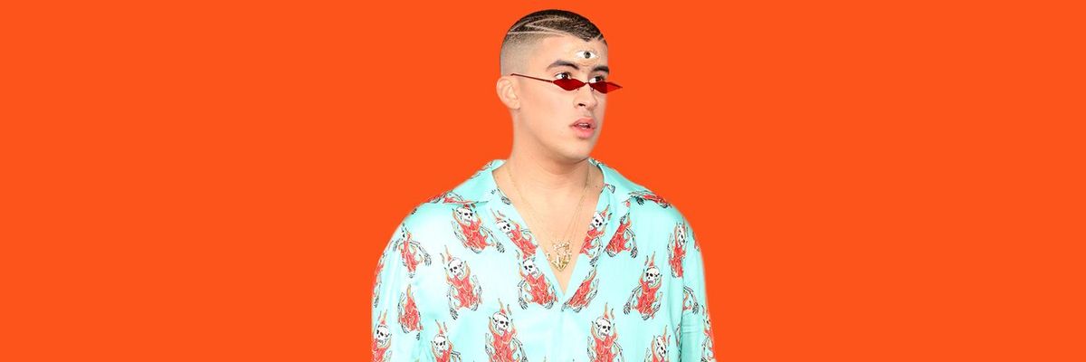 Pictured: Bad Bunny wearing a coral shirt, sunglassess and a third eye on his forehead 