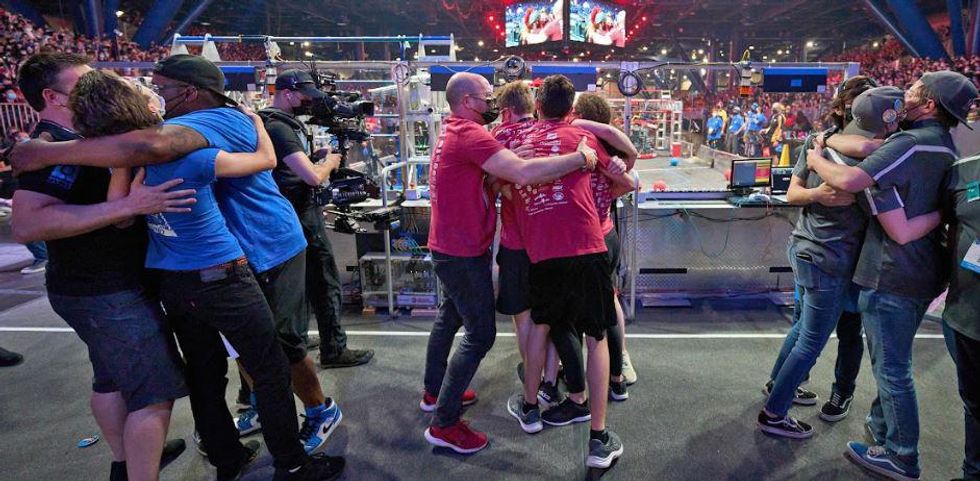 Teams of people hugging