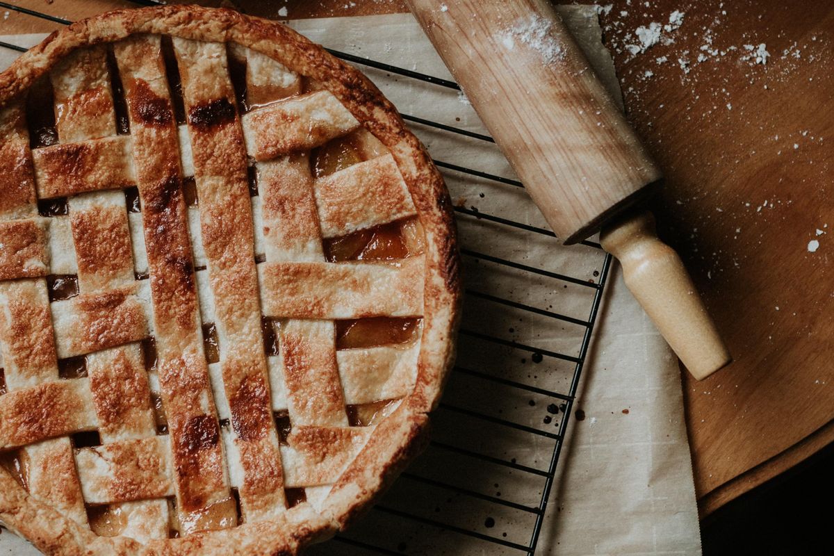pie and baking roller on counter with flour