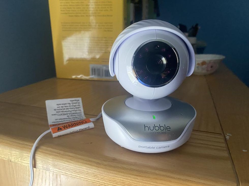 a photo of hubble connected smart baby monitor on a dresser