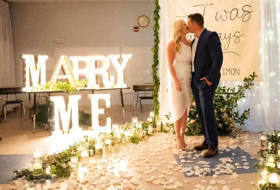Couple get engaged in classroom