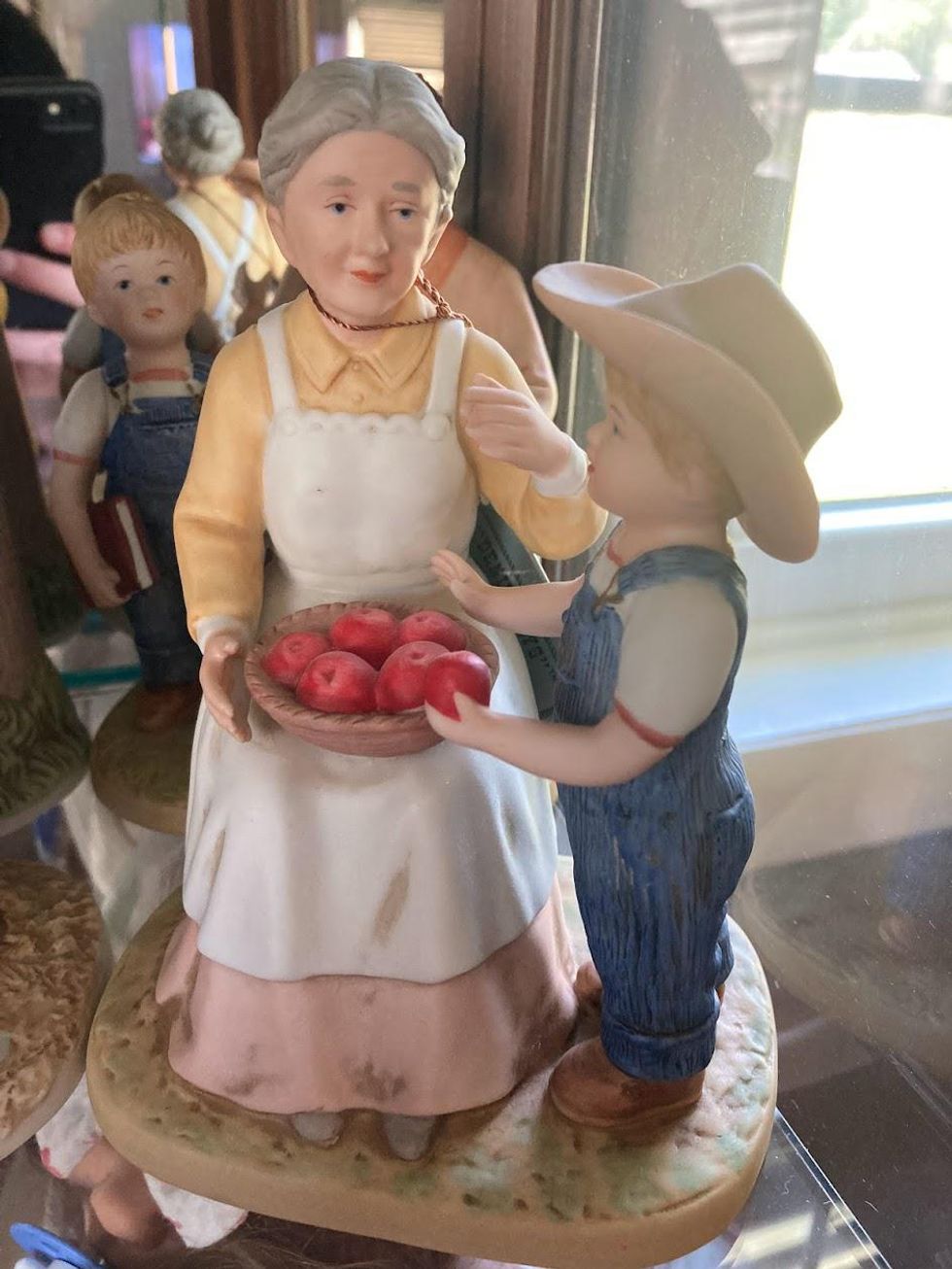 Denim Days figurine -- boy grabbing apple from grandma)