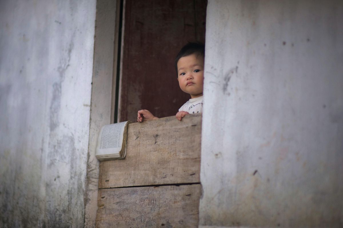 toddler falls; man catches toddler; CCTV