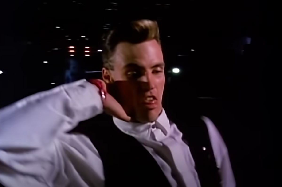 Vanilla Ice dancing in white blouse with black vest