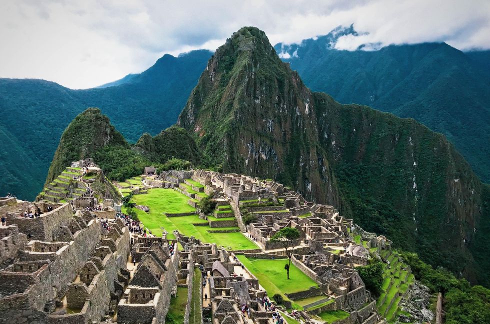 Aerial view of the ruins and mountain range of Machu Picchu