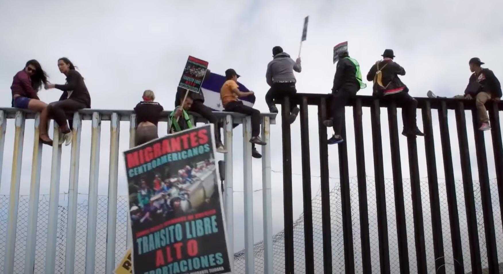 migrants border fence