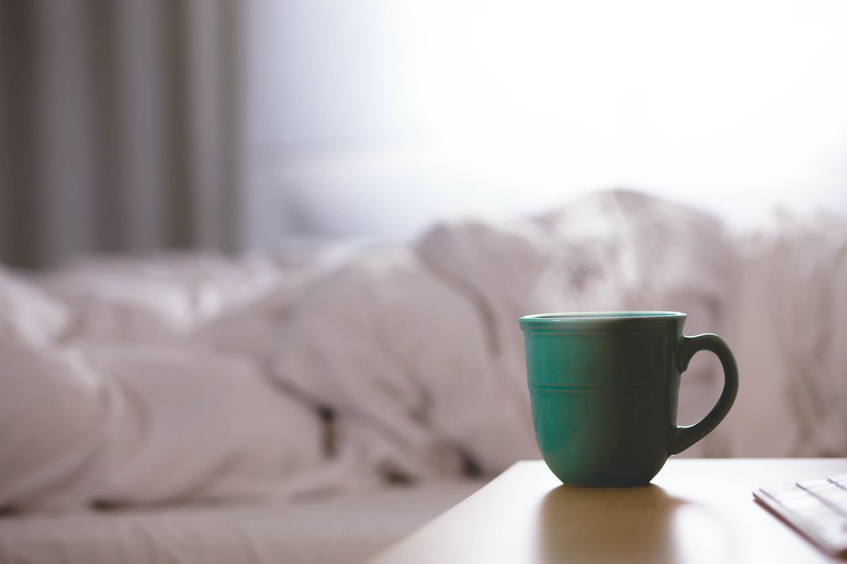coffee cup next to bed 