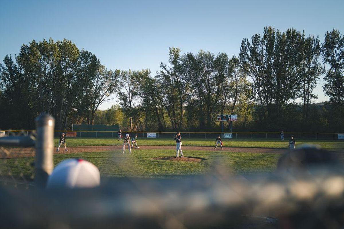 Little League player comforts distraught pitcher whose errant throw hit him in the head