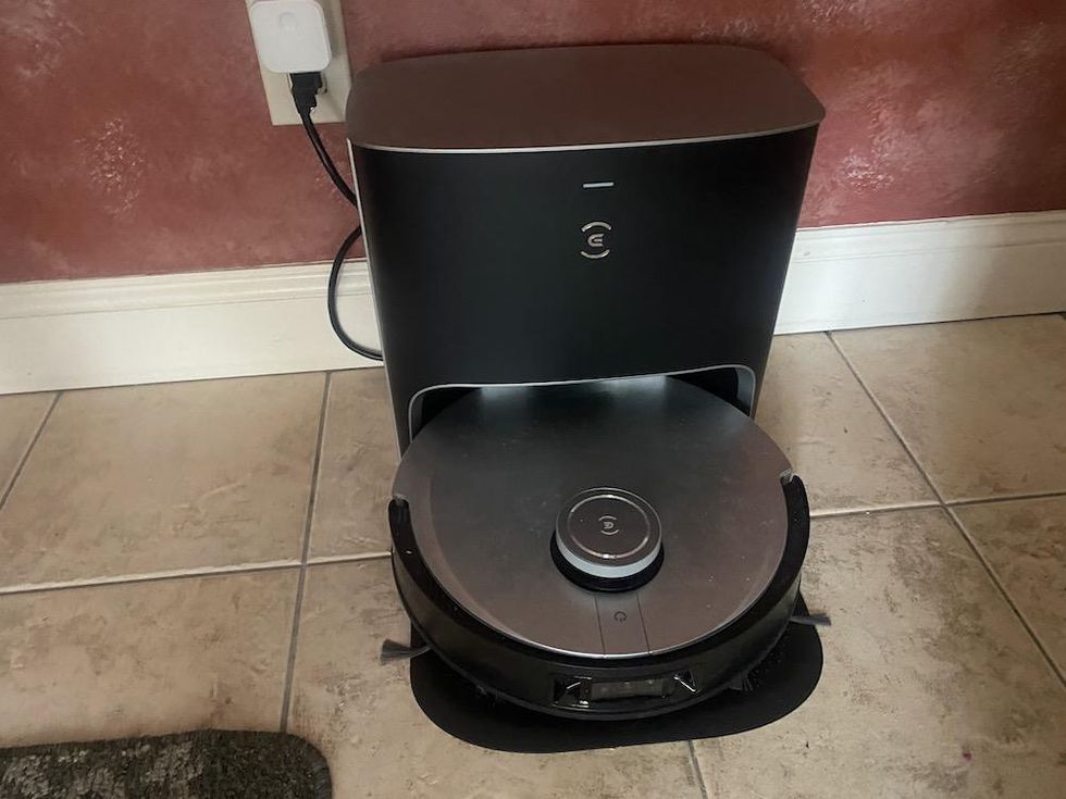 a photo of Ecovacs Deebot X1 Plus robot vacuum on a kitchen floor