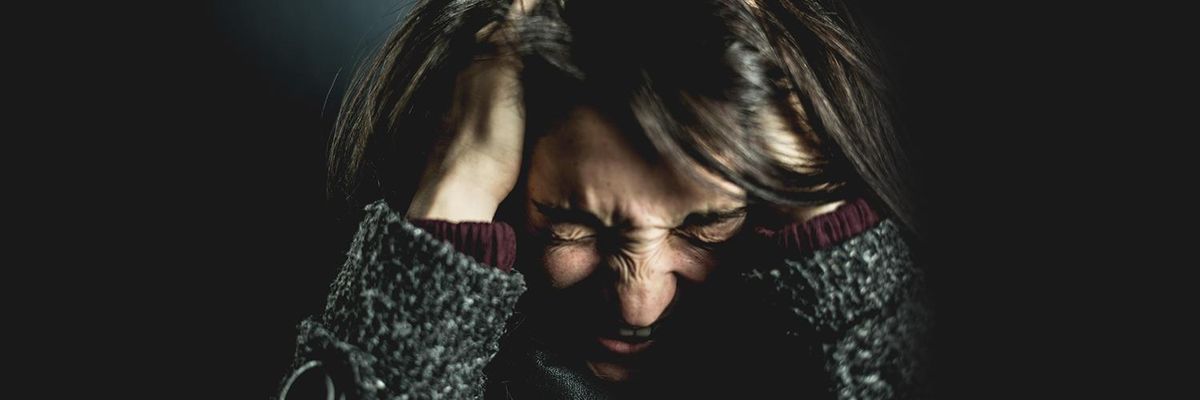 Woman grabbing her hair our of frustration