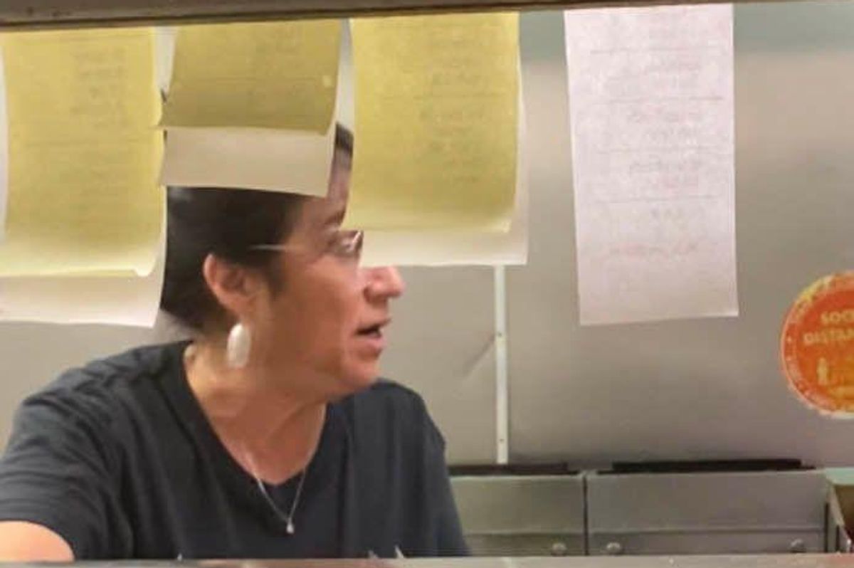woman working in a restaurant kitchen