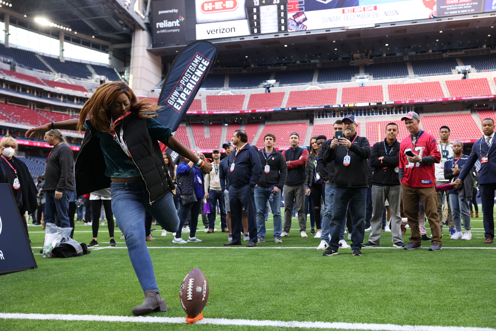 Woman kicking field goal