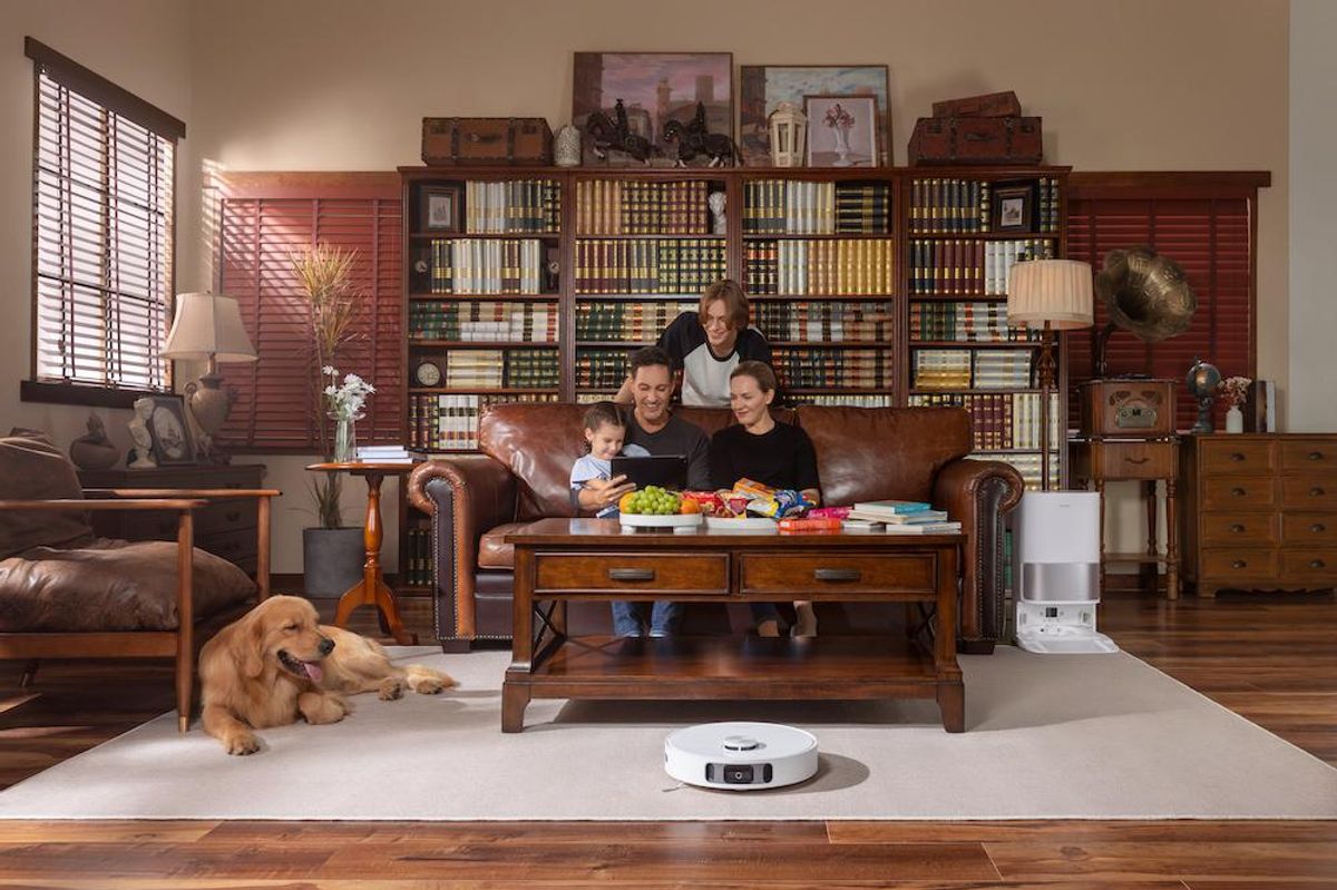 a photo of a family in the den with new DreameBot L10s Ultra robot vacuum