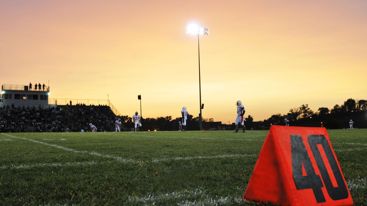 Football game at sunset.