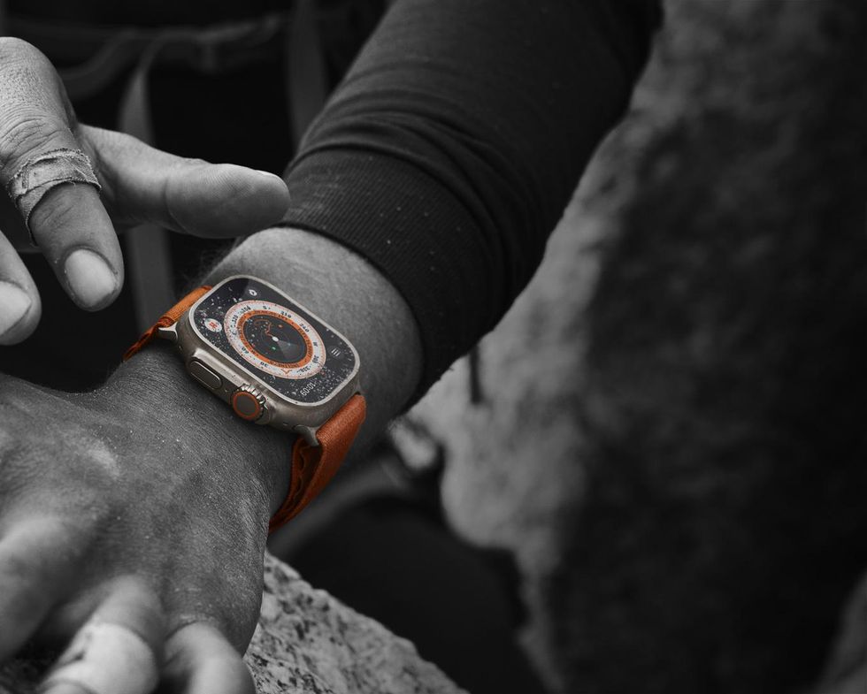 a photo of Apple Watch Ultra on a man's wrist.
