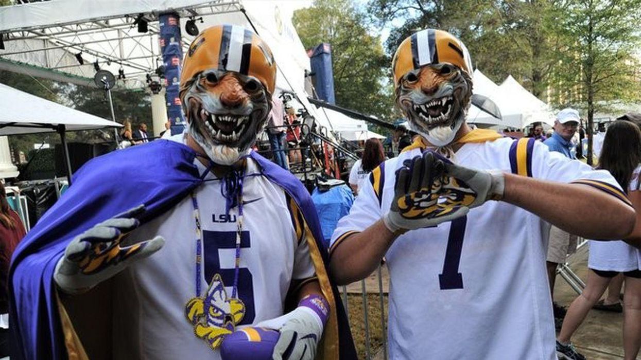 Two LSU fans tailgate.