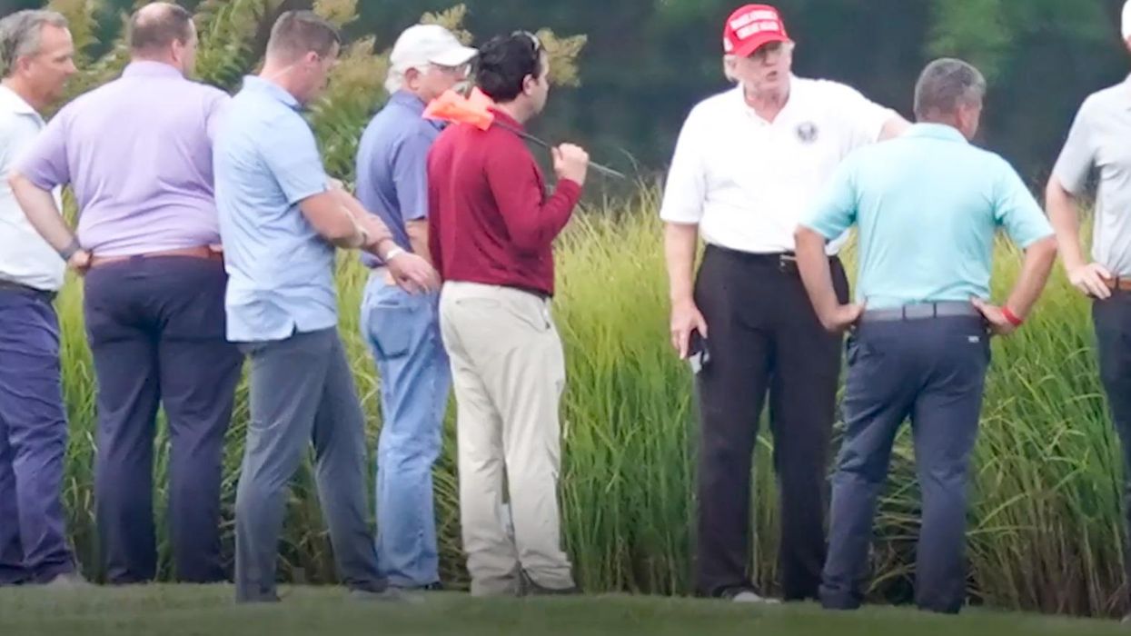 After Flight To Washington, Trump Seen With Large Group On Golf Course