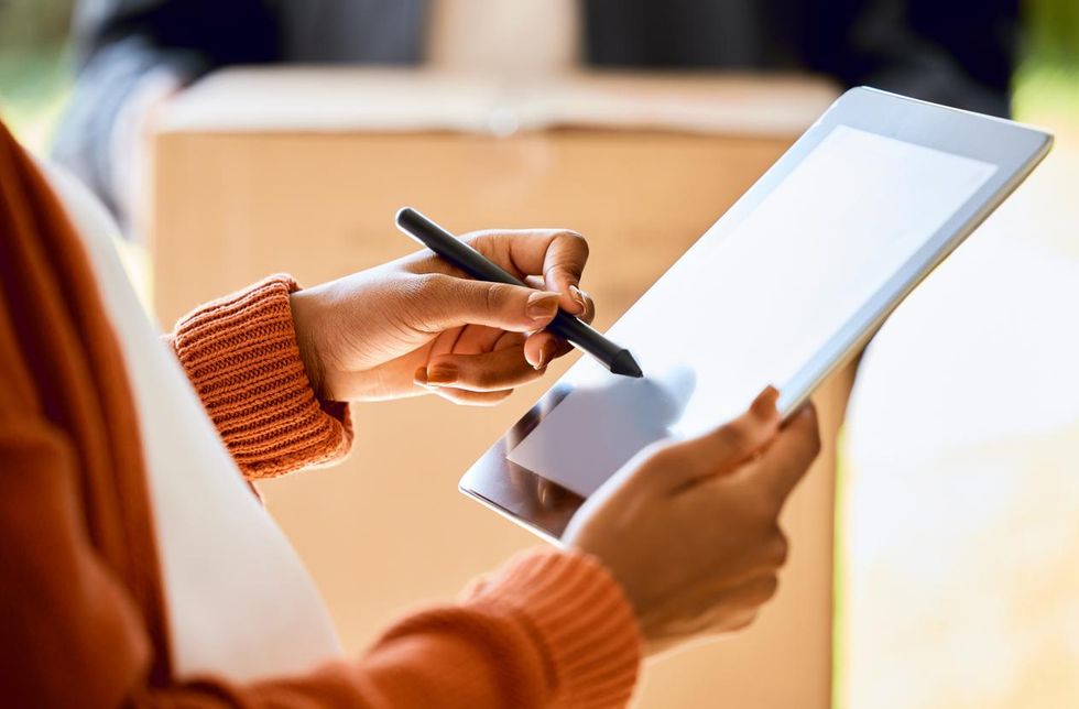 a photo of a woman using a smart pen