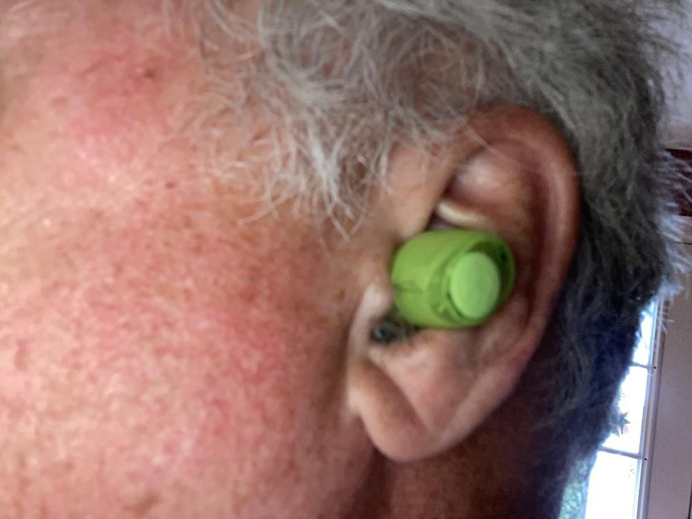 a photo of Skullcandy Transparency Series Jib True 2 Wireless Earbuds in a man's ear.