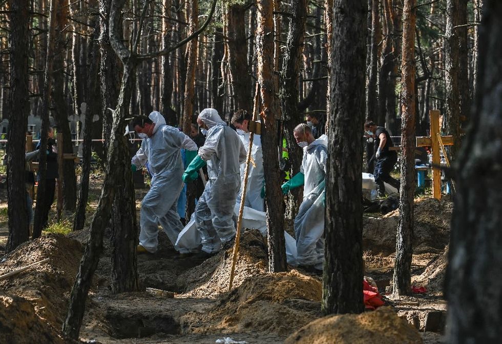 Kremlin Dismisses Mass Burial Discoveries In Ukraine As 'Lies'